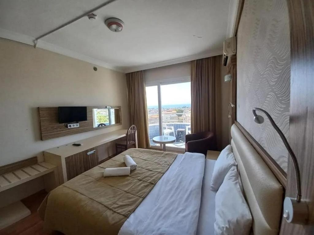 Moonstar Hotel คูซาดาซี ภายนอก รูปภาพ